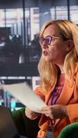 Vertical Angry female CEO yelling at her executive assistants due to business failure, showing her frustrations and disappointment because of the ruined project. Furious irritated general director. Camera A. video