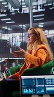Vertical Team of business directors meeting to evaluate performance metrics for the employees, comparing numbers in a briefing meeting. Female CEOs in a men dominated corporate environment. Camera B. video