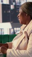 Vertical Black business entrepreneur pitching a new project idea to a shareholder via videocall, discussing about investing more funds for global expansion. Female CEO with determination for growth. Camera A. video