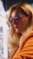 Vertical Distraught detached businesswoman suffers from depersonalization and derealization because of the workload and responsibilities. Entrepreneur emotionally disconnected from reality. Camera B. video
