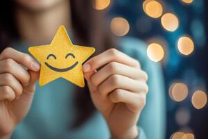 Happy person holding smiling star symbol, representing positivity and support photo