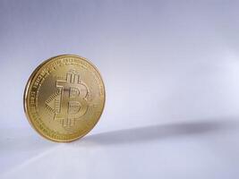 bitcoin cryptocurrency on white background. bitcoin with metal material like gold color. bitcoin is digital asset of instrument future investment photo