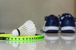 Set of badminton equipment with rackets, shoe, and shuttlecocks photo