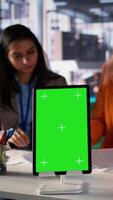 Vertical Entrepreneurs team with a success story work next to green screen, using professional tools to meet project deadline and obtain business growth. Leadership skills and professionalism. Camera B. video