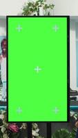 Vertical Asian retail worker recommends new designer items next to chroma key screen, suggesting colorful clothes for middle eastern man. Female assistant helping client with wardrobe essentials. video