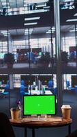 Vertical Multiethnic team of experts sharing insight next to chroma key screen, evaluating the performance metrics of the company and the staff. Female leaders analyzing data infographics. Camera B. video