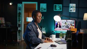 Employee working from home talking with coworkers during business meeting on videocall in office. Teleworker speaking in remote teleconference call from living room, camera B video