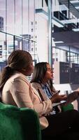 Vertical Multiethnic female managers getting in a fight and screaming at each other, angry and frustrated about the crisis. Businesswomen being furious and upset, disappointed enterprise failure. Camera B. video