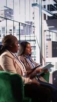 Vertical Skilled enterprise leader in a meeting strategizing with stakeholders to discuss ideas for company development. Ambitious diverse women in a men dominated business environment. Camera B. video