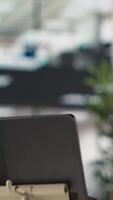 Vertical Professional black director leading a conference with his staff, discussing project details and strategic objectives. Virtual chat ensures efficient communication across locations. Camera A. video
