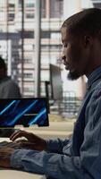 Vertical Employee feels emotional strain and frustration of business failure, disappointment and challenges. Man goes through a crisis with mental exhaustion to find solutions for the struggles. Camera B. video