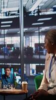 Vertical Multicultural team of businesswomen leads an online presentation, showcasing their leadership and success in a remote work environment. Sharing ideas with their boss on call. Camera A. video