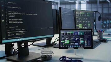 PCs, headphones and tablets in data center employing machine learning technology to maintain company network infrastructure. Electronic devices used in server room to ensure optimal system performance video