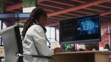 Teleworking programmer using computer for artificial intelligence computing through self learning algorithms. Remote worker working with AI deep neural networks on desktop PC, camera B video