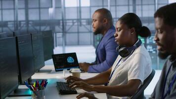 Admin in data center drinking coffee and implementing AI predictive maintenance systems. Server hub worker enjoying hot beverage, using artificial intelligence to identify hardware failures, camera A video