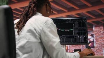 Happy day trader using PC, feeling satisfied after purchasing well performing stocks and selling at a profit. Cheerful forex trader joyous after making money with stock exchange portfolio, camera B video
