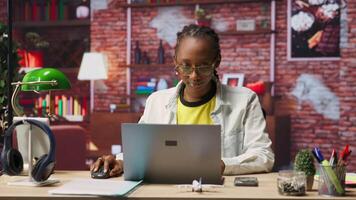 Freelancer in home office opening laptop, starting working on tasks. Remote employee using electronic device to do customers relations job online, answering inquiries, camera B video