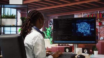Admin writing code on computer and doing maintenance on artificial intelligence neural networks computerized model. Tech support expert typing on keyboard, doing checkup on AI systems, camera A video
