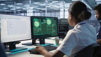 Admin in server hub trying to protect gear from hacker attack stealing sensitive information. Data center employee struggling to erase virus after seeing security breach alert on monitor, camera A video