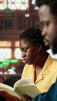 Vertical Diligent students reciting poetry together at the campus library, studying for a literature exam. Team of pupils showcasing productivity and commitment for self improvement. Camera B. video