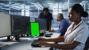 Admin using isolated screen tablet, working in server farm to optimize it for data processing requirements. IT specialist coding on mockup device in data center, camera A video