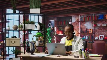 Freelancer in home office opening laptop, starting working on tasks. Remote employee using electronic device to do customers relations job online, answering inquiries, camera A video