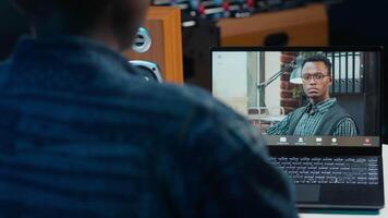 Remote employee calls manager remotely using internet videocall to ask for feedback on project progress. Teleworker in home office requesting assistance from leader in teleconference meeting, camera A video