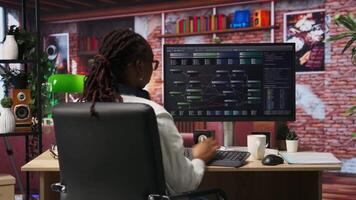 Teleworking programmer using computer for artificial intelligence computing through self learning algorithms. Remote worker working with AI deep neural networks on desktop PC, camera B video