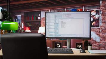 UI on PC screen in home office with programming code being executed. Coding application UI used by IT programmers to write and test code in modern apartment, panning shot video