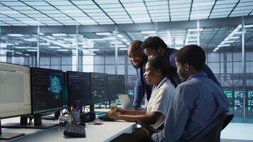 Data center coworkers laughing, having fun while maintaining company network infrastructure. Server hub colleagues enjoying time together in office, telling jokes, having conversation, camera A video