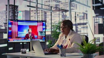 Goal oriented black CEO analyzing global trends in high end office, planning the next steps for expansion and investment opportunities. Emphasizing executive power and work ethic. Camera B. video