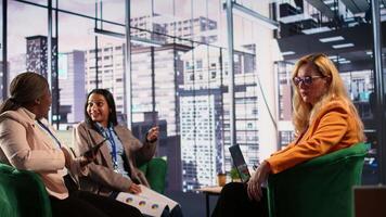 Diverse businesswomen trying to discuss with disconnected detached CEO, suffering from depersonalization and apathy because of burnout. Gender equality women in business concept. Camera B. video