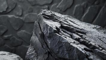 Dark stone texture background showing rough surface of natural rock formation. photo