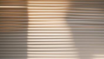 Sunlight filtering through venetian blinds creating stripes of light and shadow. photo