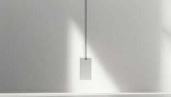 A white tag with a black band is hanging on a table. photo