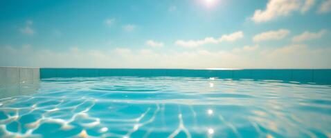 Crystal clear waters invite relaxation by the shimmering poolside under the bright midday sun photo