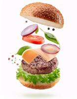 Delicious Burger with Floating Ingredients on White Background photo
