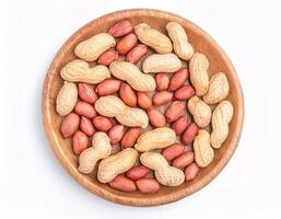 Scattered Peanuts from Above on White Background photo