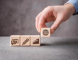 Strategic Business Planning with Wooden Cubes and Icons on Grey Surface photo