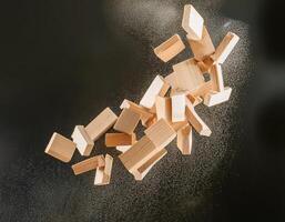 Falling Wooden Pieces from Above, Creating a Dynamic Impact photo