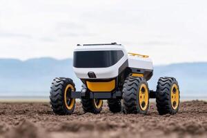 Robotic vehicle navigating rugged terrain on an overcast day in a remote landscape photo