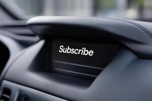 Display in car console shows subscribe message while vehicle is parked and idle during daytime photo