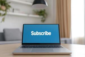 Laptop displaying subscribe message in a cozy indoor setting with soft lighting and minimalistic decor photo