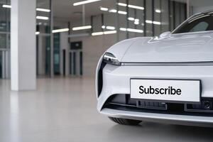 Modern electric car interior showcasing sleek design and subscription sign in a spacious dealership during daylight hours photo