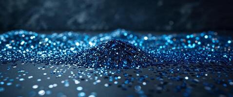 Sparkling blue glitter creates a mesmerizing texture in a dark setting photo