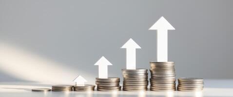 Investing in growth financial success with stacked coins and upward arrow studio setting abstract concept. photo