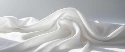 Elegant smooth white fabric texture with gentle folds and waves background photo