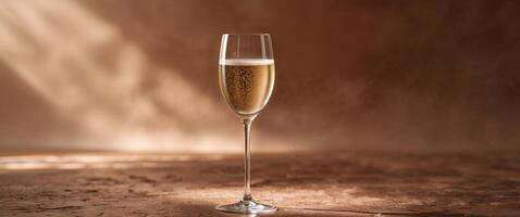 Elegant Champagne Glass on Textured Brown Floor with Soft Shadows Ideal for Festive Backgrounds and Copy Space for Text Integration photo