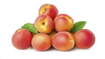 Fresh ripe apricots arranged in a pyramid with green leaves on a white background showcasing vibrant colors photo