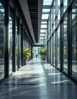 An empty hallway with lots of windows and plants photo